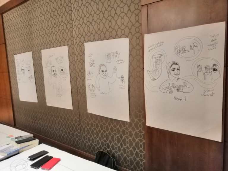 Live cartoon illustration by Sameh Samir showing a business meeting for Al-Ain News Foundation's board at the Nile Ritz Hotel in Cairo.