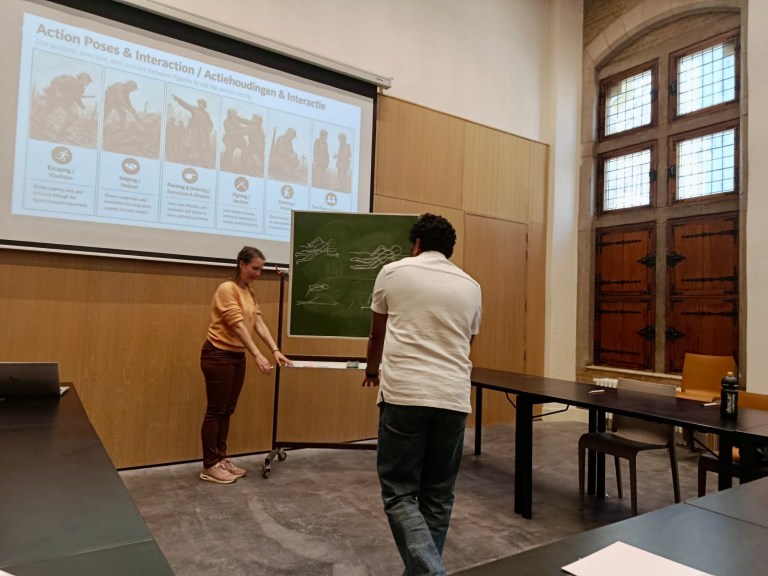 Sameh Samir giving a political cartoon workshop at Ypres World War I Museum during Belgian Heritage Day, with attendees watching.