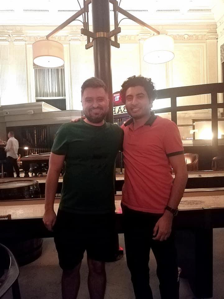 Sameh and Omar Momani sitting together in a restaurant setting